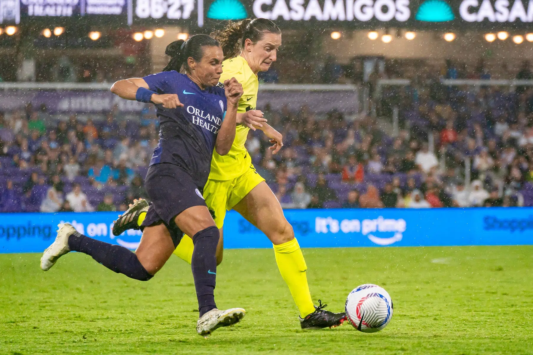 Andi Sullivan and Marta battle for the ball.