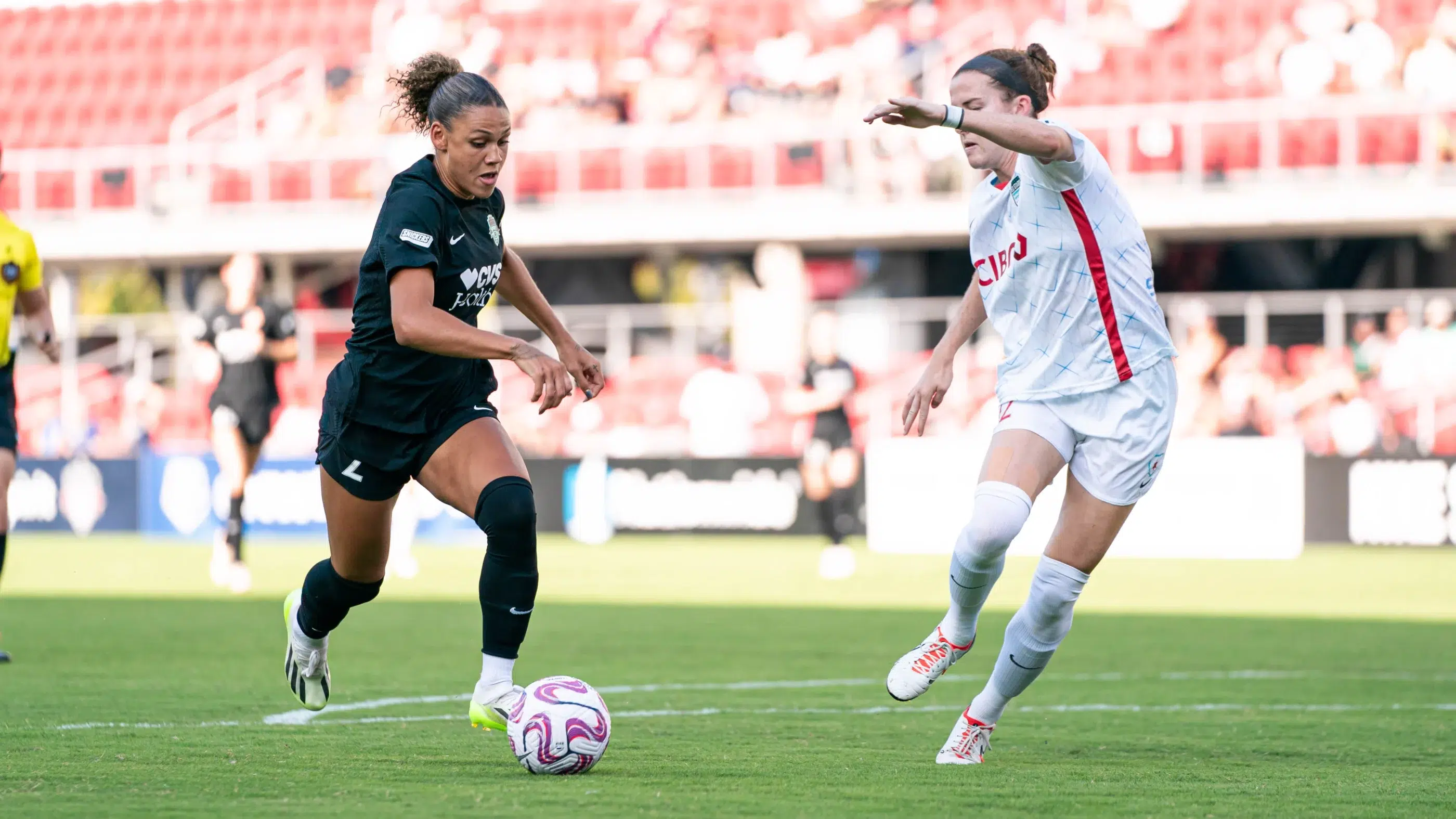 Trinity Rodman dribbles the ball past a Chicago Red Stars defender.