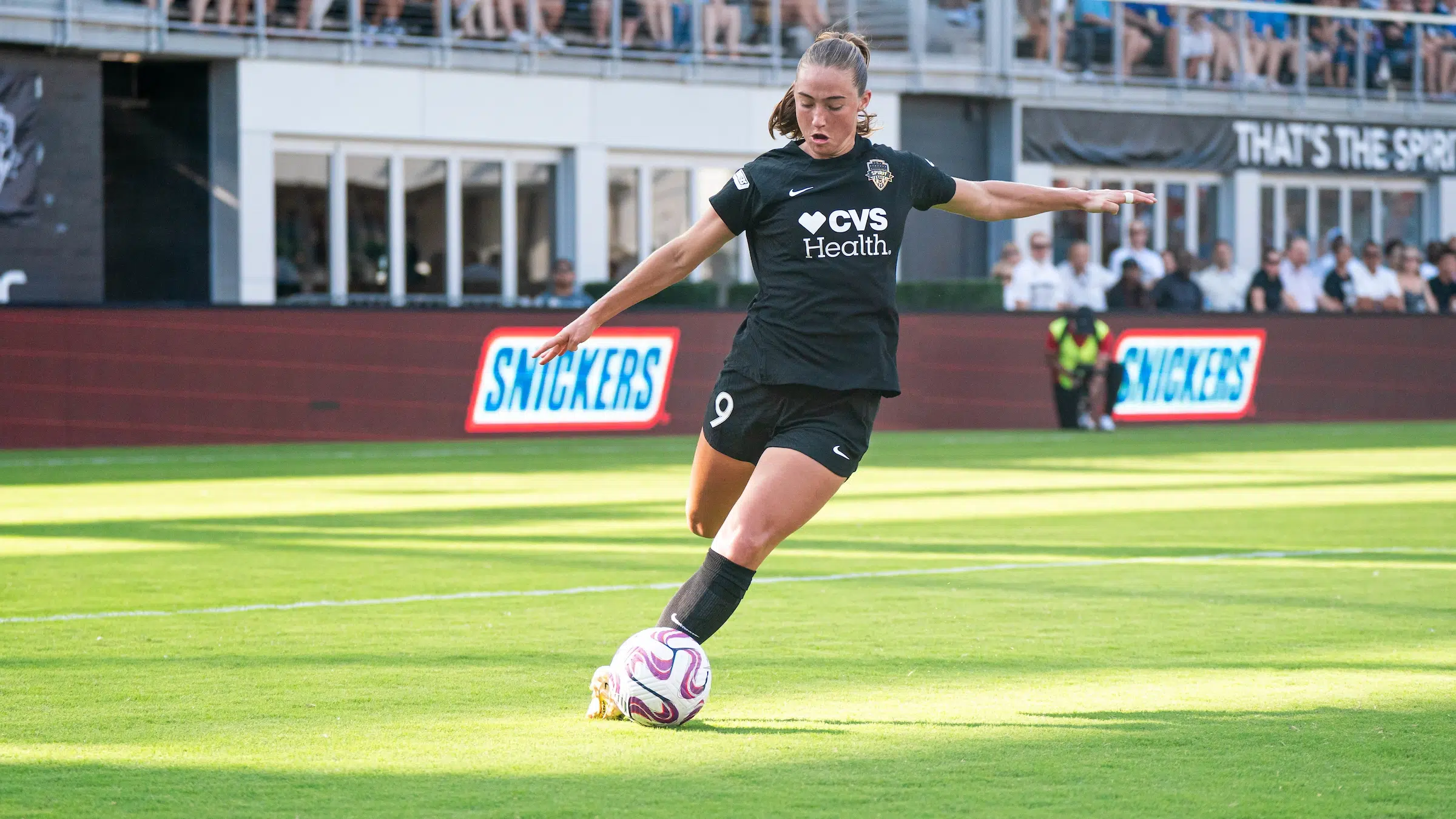 Tara McKeown goes to cross a soccer ball.