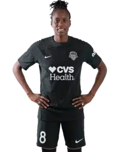 Ouleymata Sarr stands with her hands on her hips in a black Spirit uniform.