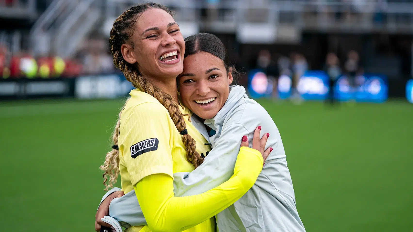 Trinity Rodman hugs Sophia Smith.