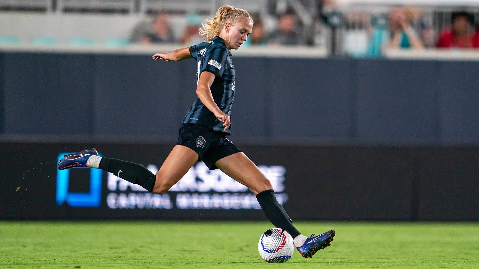 Esme Morgan winds up to kick the ball.