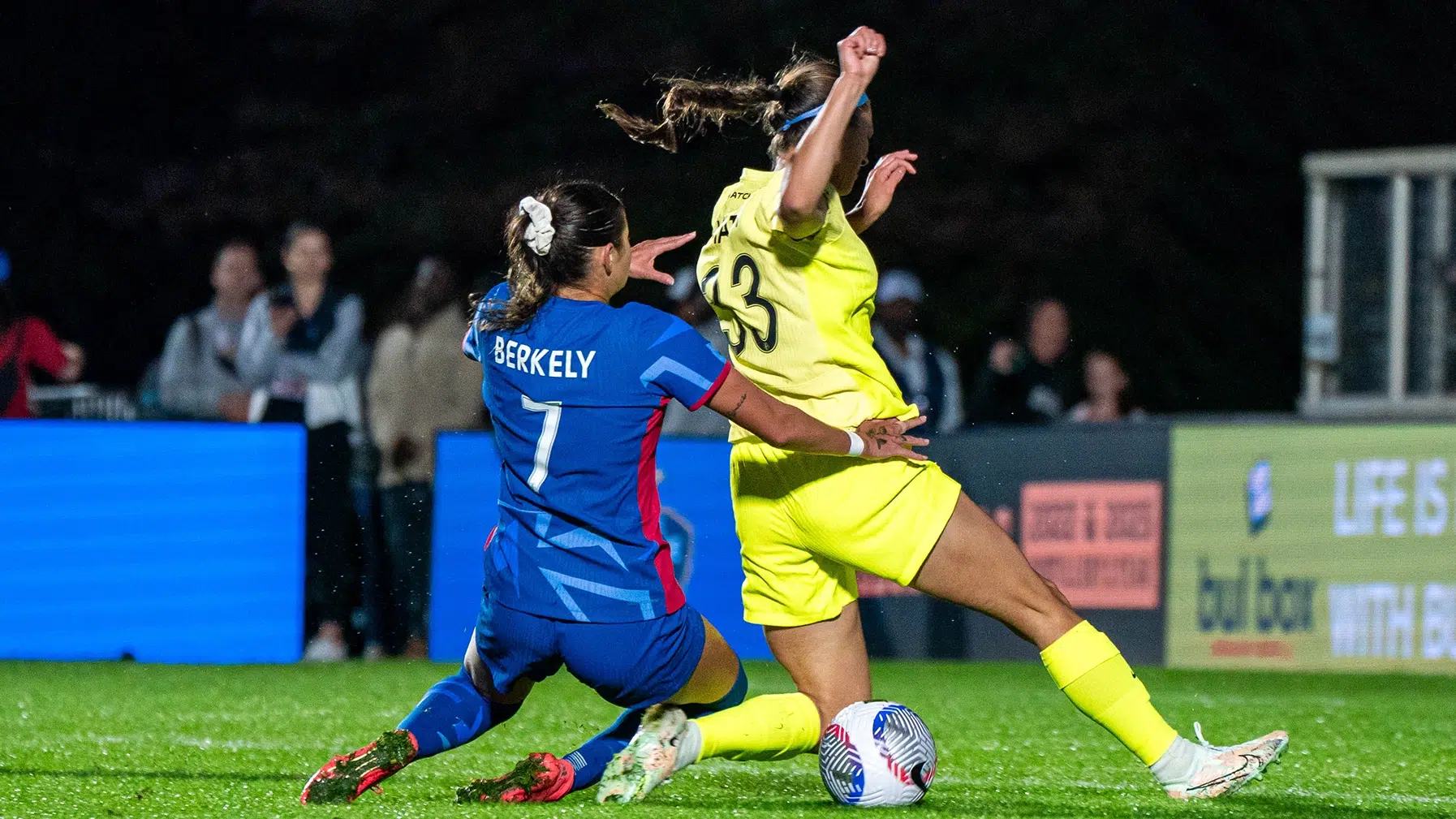 Ashley Hatch taken down by a North Carolina defender.