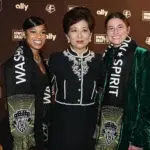 (from left to right) Croix Bethune, Michele Kang, and Kate Wiesner pose for a photo at the 2024 NWSL Draft.