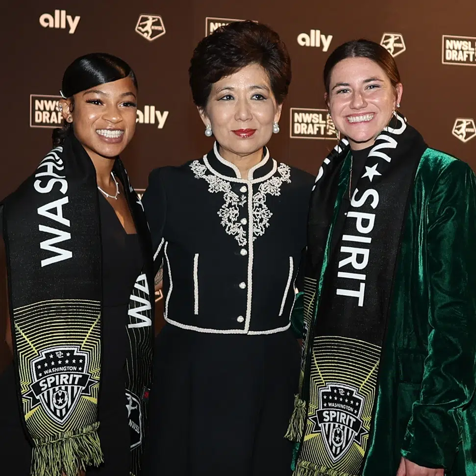 (from left to right) Croix Bethune, Michele Kang, and Kate Wiesner pose for a photo at the 2024 NWSL Draft.