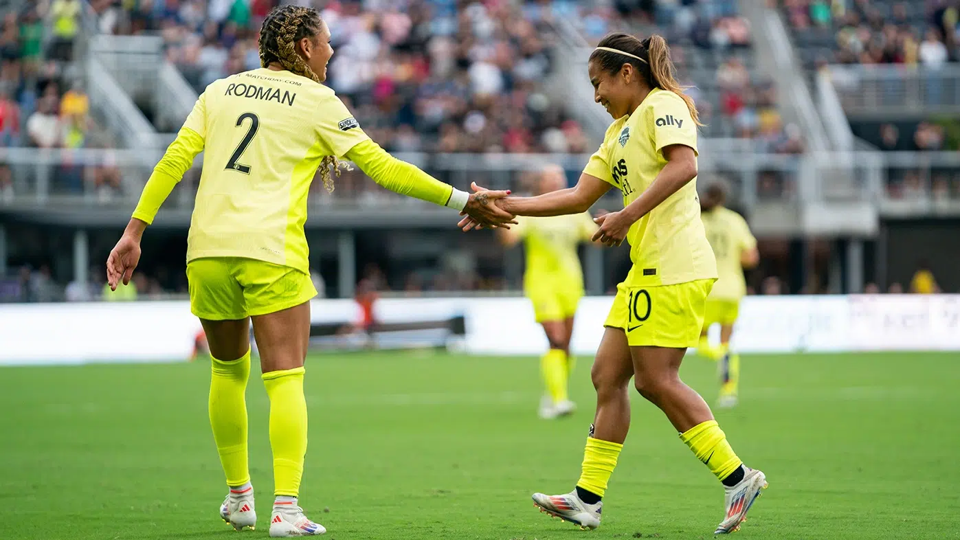 Trinity Rodman and Leicy Santos Shake hands.