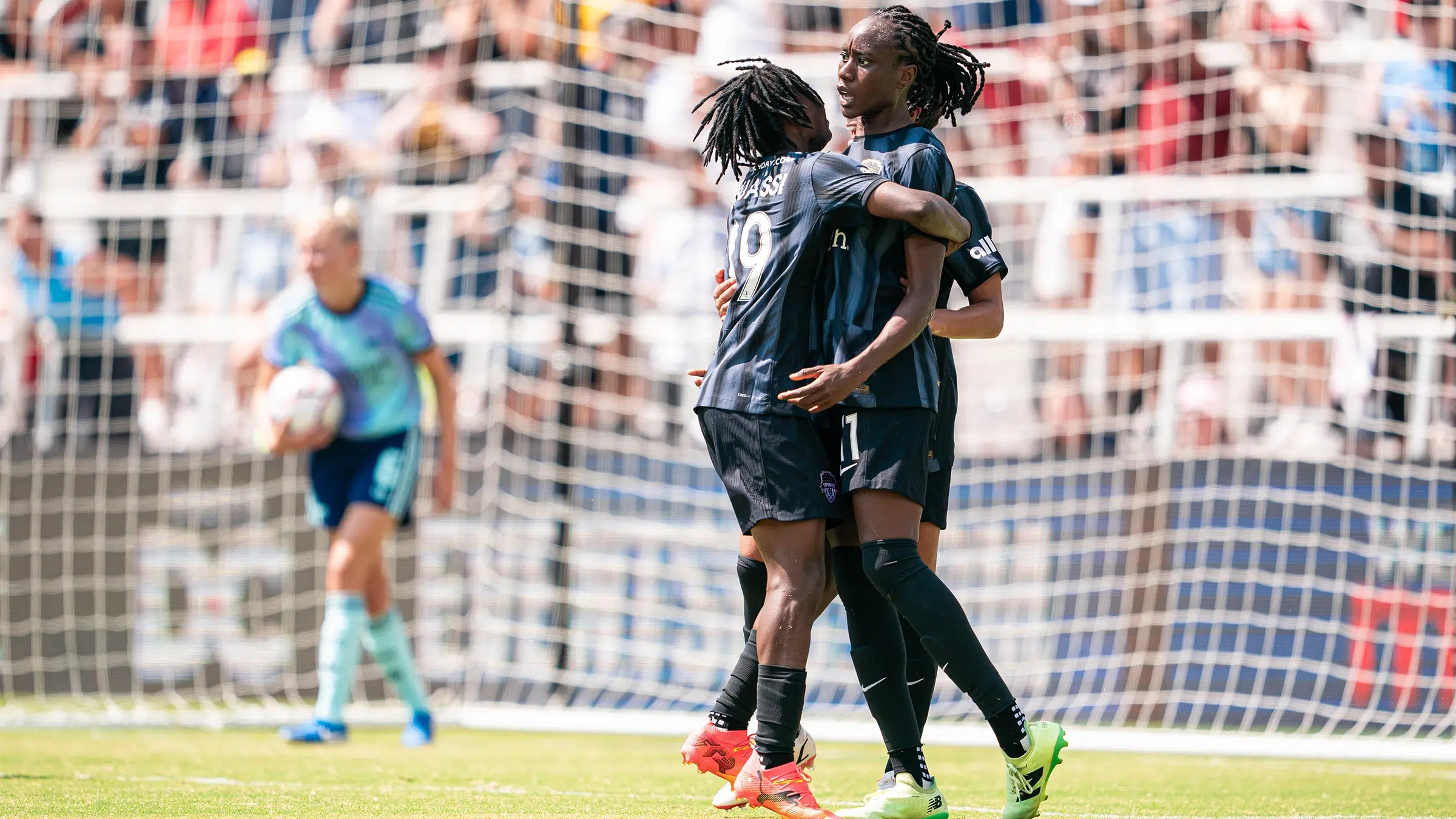 Ouleye Sarr and Rosemonde Kouassi embracing.