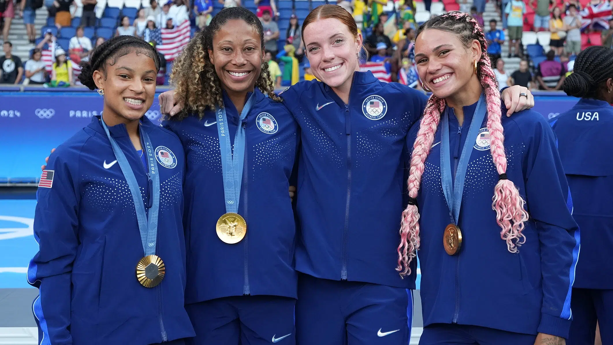 Croix Bethune, Casey Krueger, Hal Hershfelt, and Trinity Rodman with their gold medals.