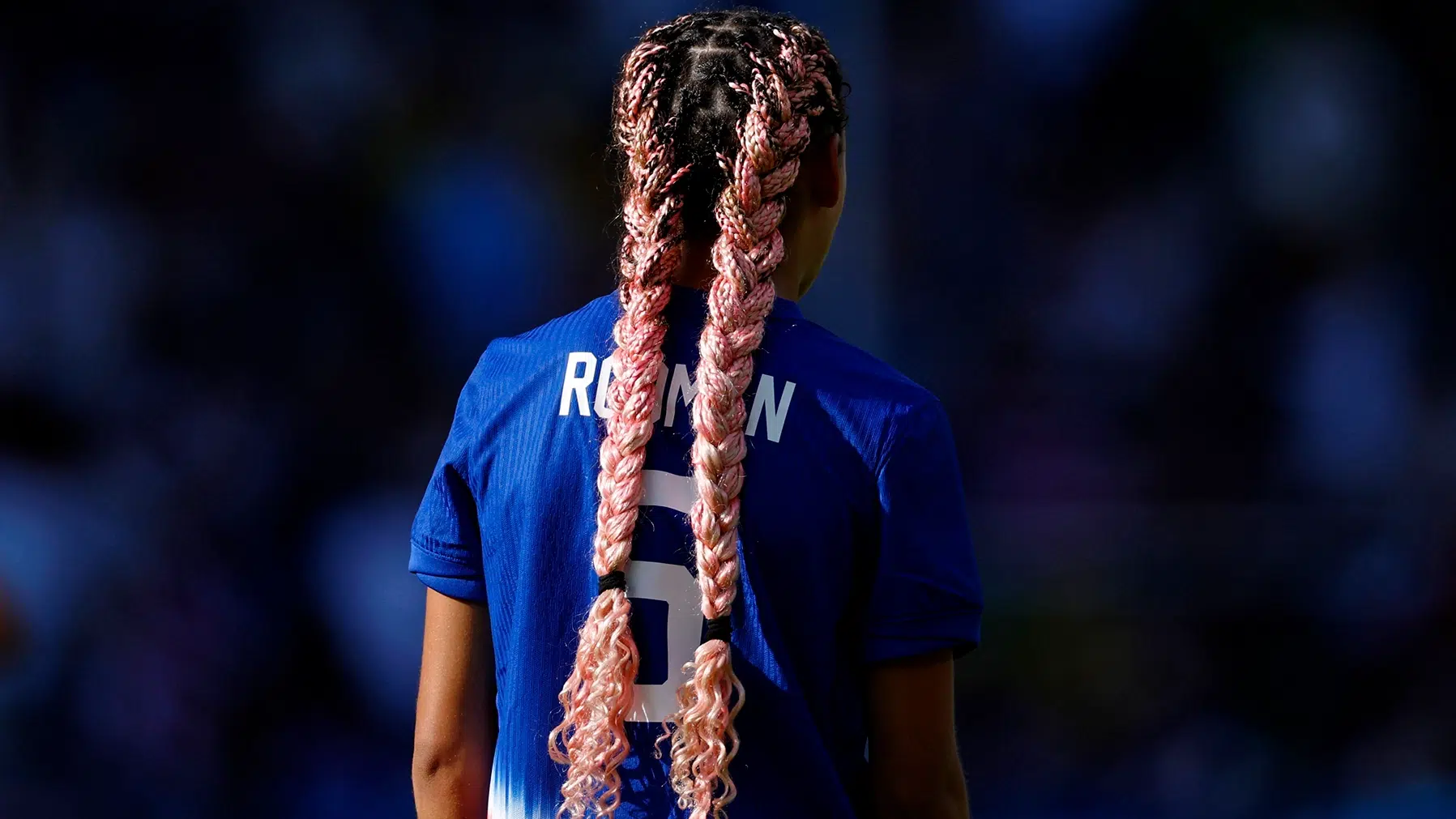 Trinity Rodman with pink braids.