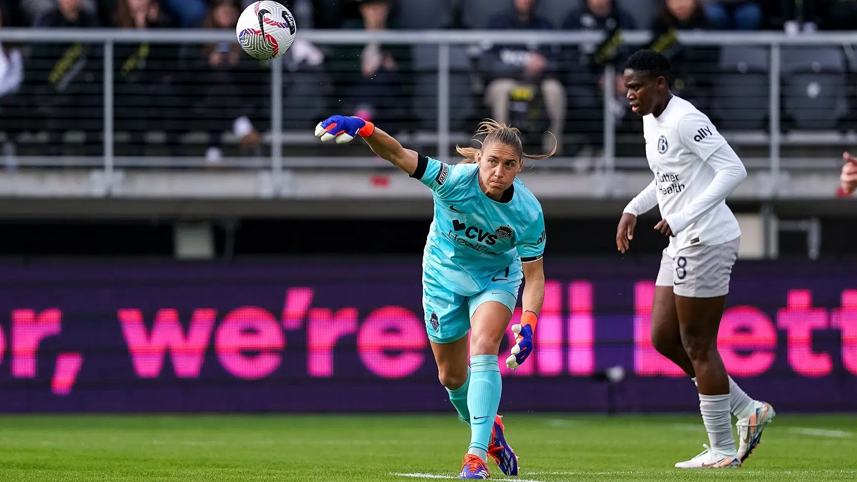 Aubrey Kingsbury in a blue goalkeeper kit throws the ball.