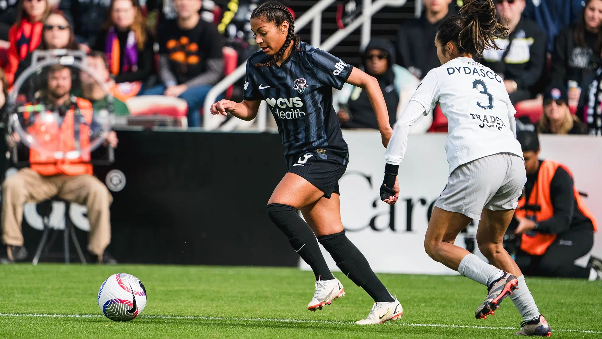 Makenna Morris dribbles the ball passed Caprice Dydasco.