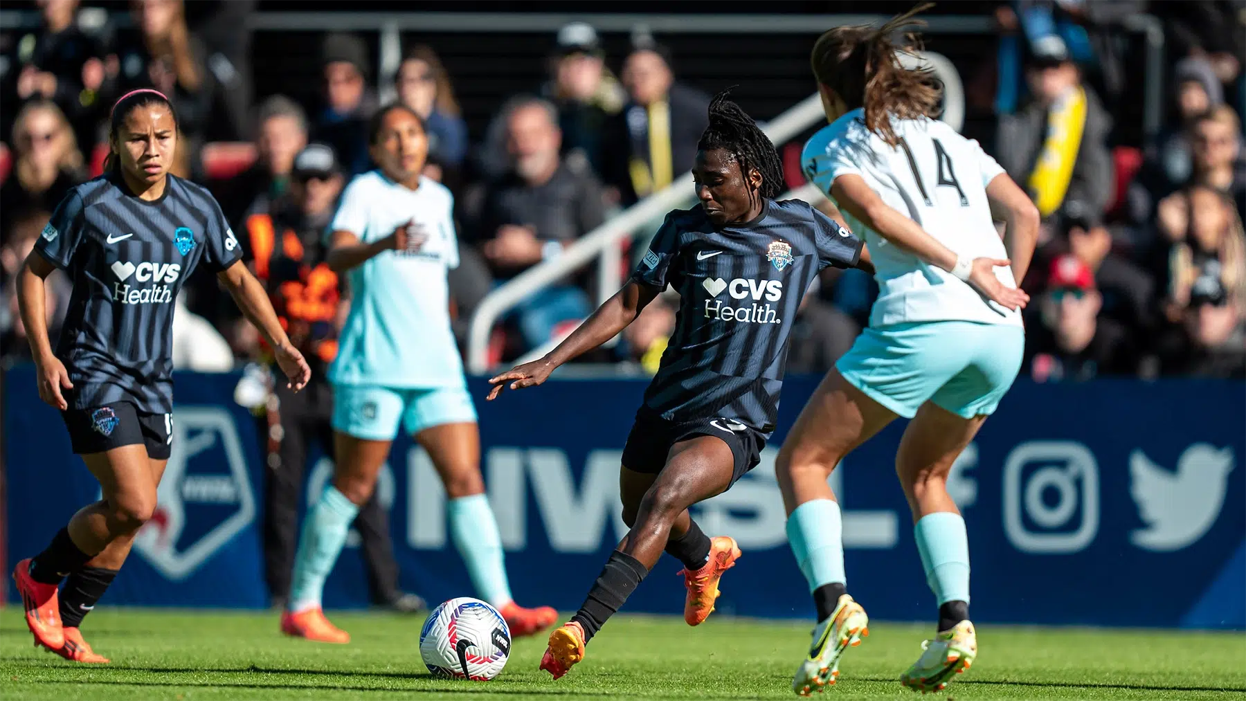 Rosemonde Kouassi winds up to kick the ball passed a defender.