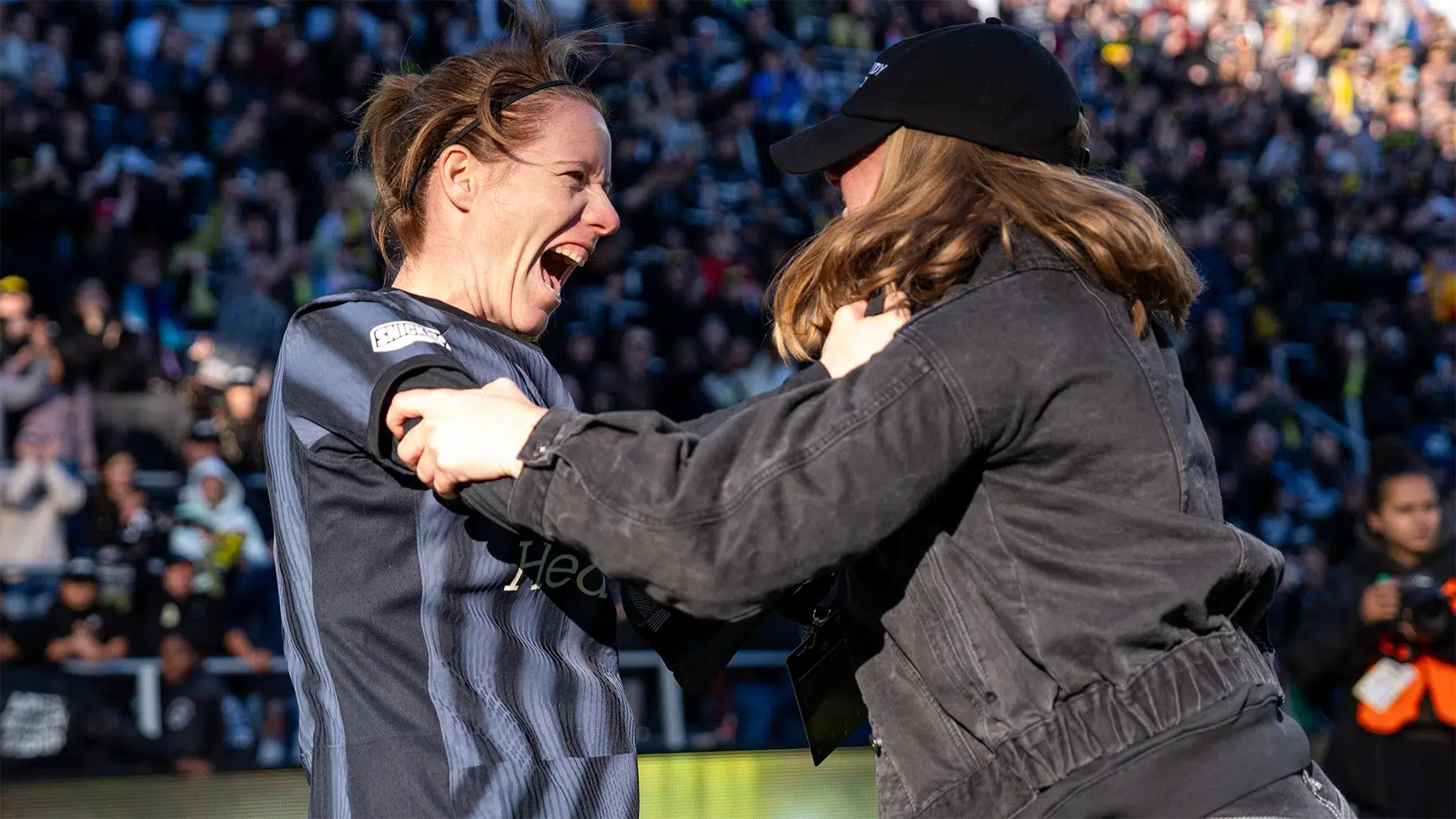 Annaig Butel and Anna Heilferty hug in celebration.