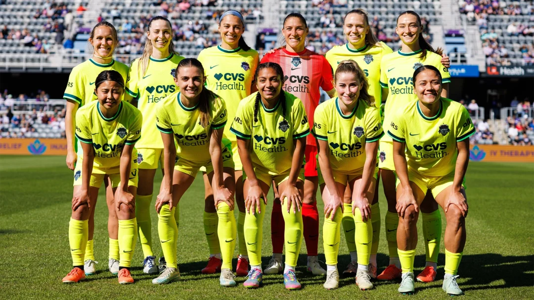 The starting eleven for the Spirit in neon yellow jerseys.