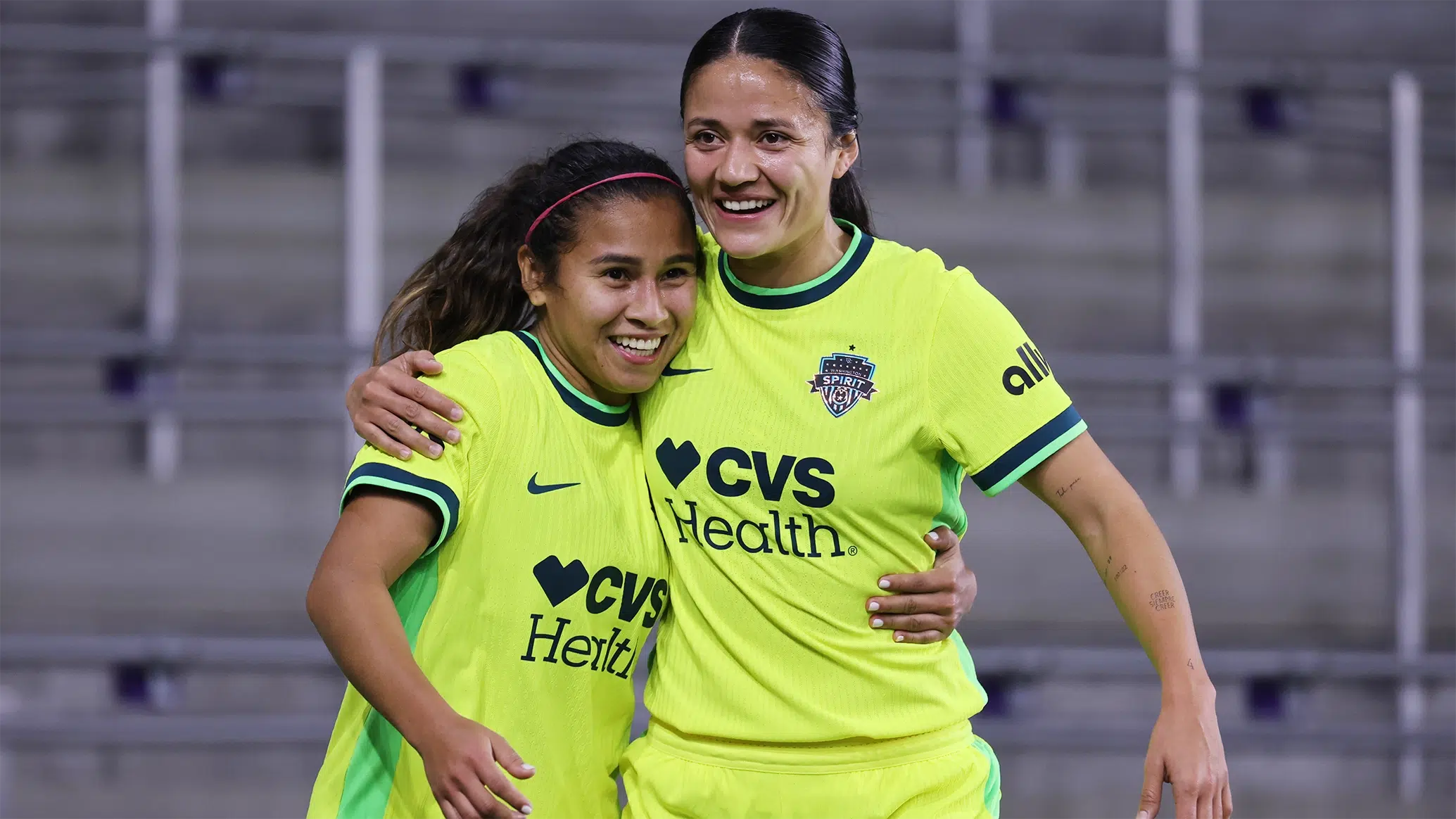 Leicy Santos and Rebeca Bernal hug.