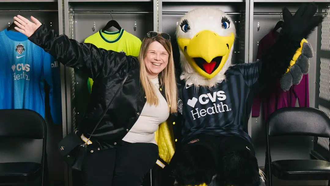 A Spirit fan and the club's eagle mascot, PK.