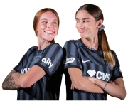 Two Washington Spirit players standing shoulder to shoulder with arms crossed